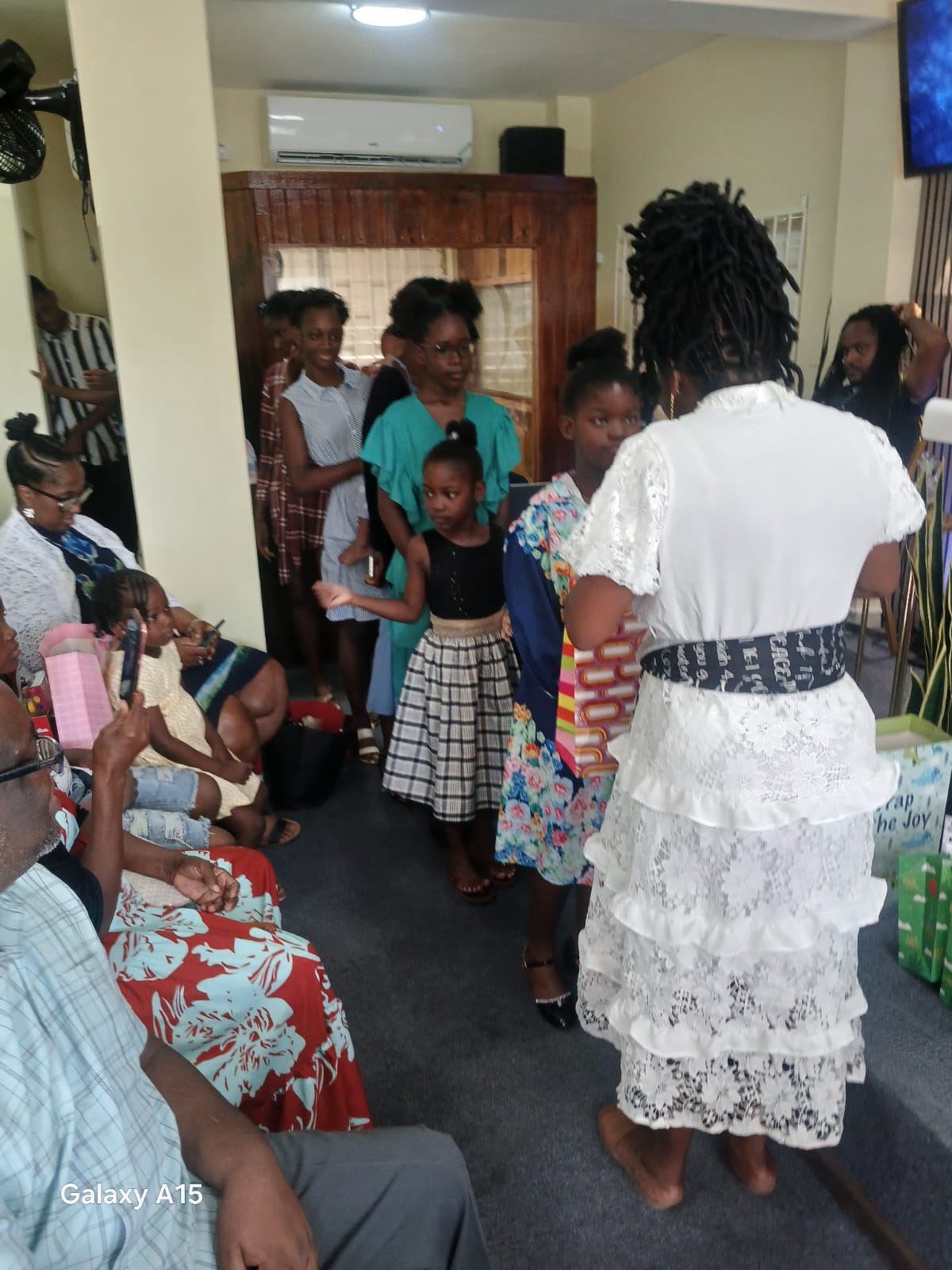 Children gathered at the front of the church during the gift presentation